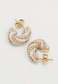 Gold hoop earrings featuring a wave design with pale pink accents and clear rhinestones along the edge. Stud backing for secure wear.