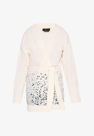 Cardigan blanc à enveloppe avec un haut en tricot texturé et une partie inférieure ornée de sequins, doté d'une ceinture à nouer et de poignets côtelés. Sequins argentés brillants pour embellissement.