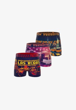 Trois boxers avec des imprimés à thème urbain : silhouette nocturne de Las Vegas, Miami Beach avec drapeau et New York avec la Statue de la Liberté et un taxi.