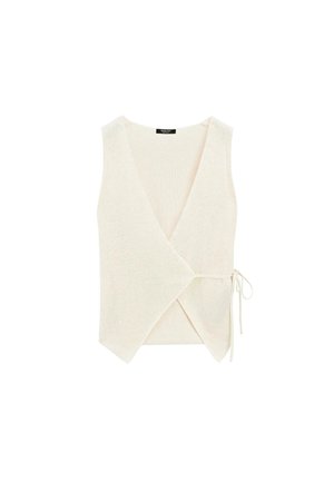 Cream sleeveless wrap top with a V neckline, featuring a textured knit fabric and a tie detail at the waist for secure closure.