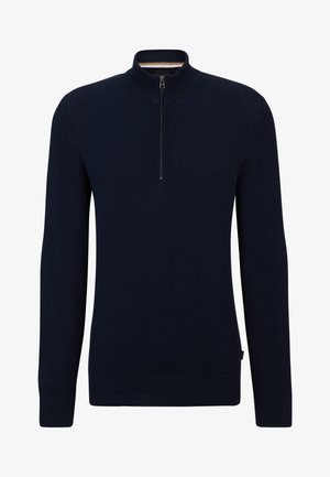 Navy blue sweater with a high collar and a half zip. Made from textured fabric, featuring ribbed cuffs and hem, with a small tag on the side.