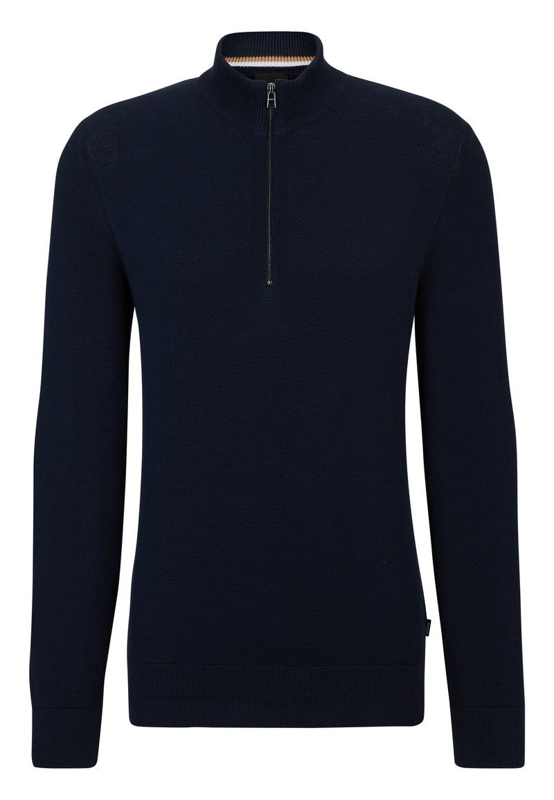 Navy blue sweater with a high collar and a half zip. Made from textured fabric, featuring ribbed cuffs and hem, with a small tag on the side.