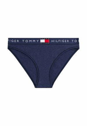 Marineblå bomuldsunderbukser med en reklamekant, der har teksten "TOMMY HILFIGER" og et logo-patch med røde, hvide og blå detaljer.