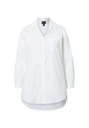 Camisa blanca de manga larga y botones, hecha de algodón. Presenta un cuello, un bolsillo delantero, un dobladillo curvado y puños con botón. Textura suave.