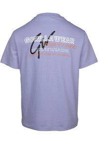 Lavender cotton t-shirt with short sleeves, featuring a graphic design in white and black reading "GORILLA WEAR" and "UNITED STATES OF AMERICA."