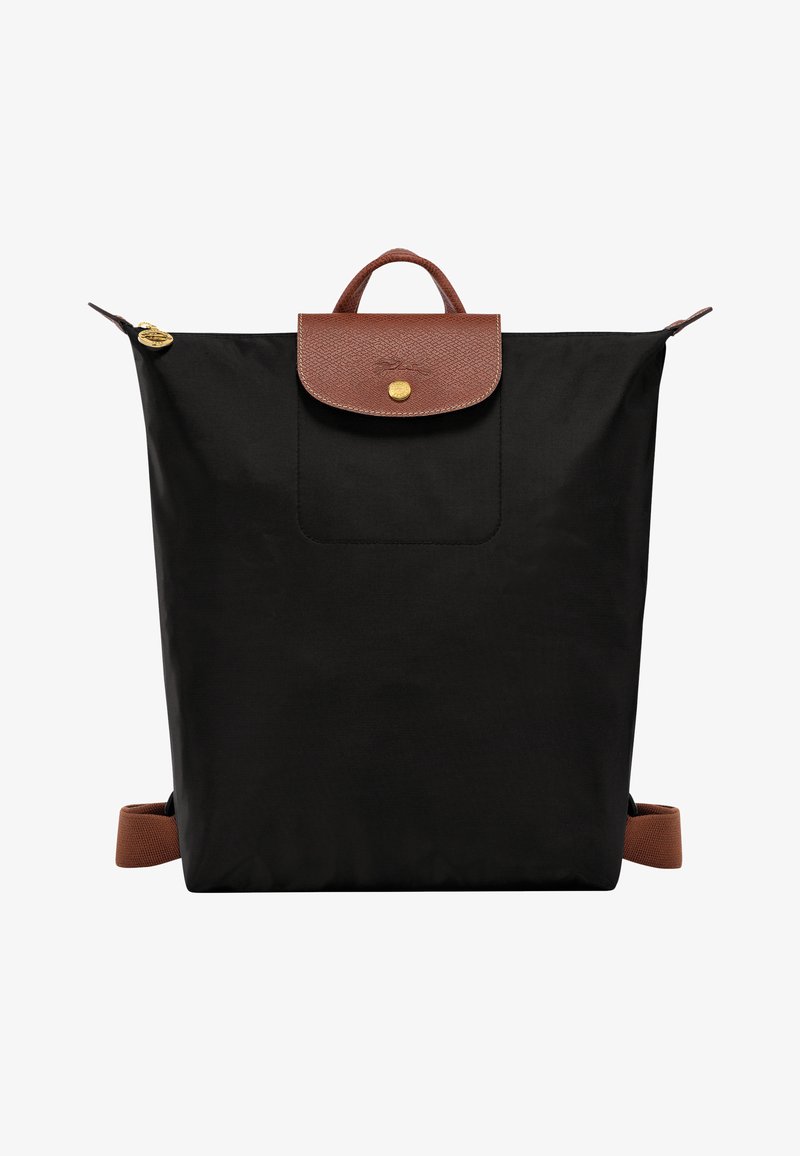 Black nylon backpack with brown leather accents. Features a top handle, front pocket, and adjustable straps. Gold-tone hardware detail.