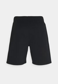 Pantaloni corti neri in cotone con vita elasticizzata, dotati di una singola tasca posteriore e una superficie liscia. L'orlo termina poco sopra il ginocchio.