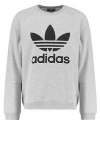 Gray sweatshirt with a crew neckline, ribbed cuffs, and hem. Features a black adidas logo and three black stripes classic design.