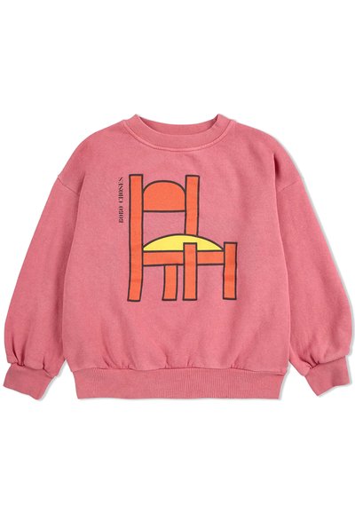 Rosa Sweatshirt mit langen Ärmeln, gerippten Bündchen und Saum. Verfügt über einen grafischen Druck eines Stuhls mit einer gelben Sitzfläche und orangeroten Details.