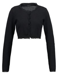 Cardigan court noir en tissu doux, avec manches longues, encolure ronde et devant boutonné avec un détail d'ourlet effiloché.
