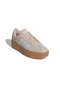 Light beige Adidas sneaker with light blue stripes, thick brown sole, and laces, shown from a front angle on a white background.