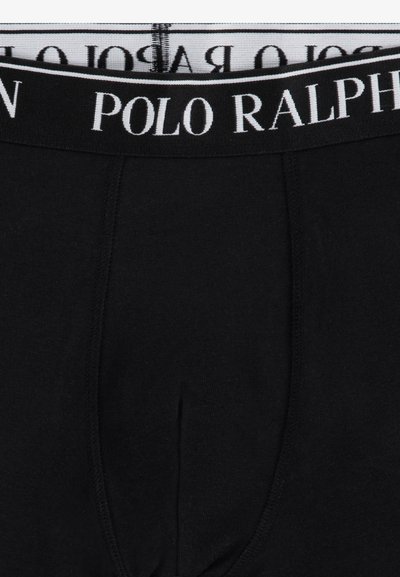 Boxers de algodón negros con una cintura blanca que lleva el logo "POLO RALPH". Textura suave con un diseño clásico, ofreciendo un ajuste ceñido.