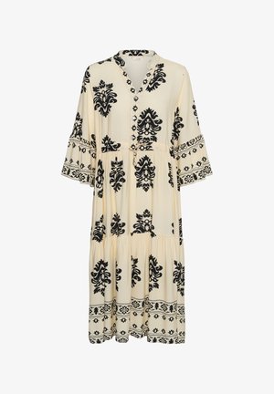 Kremowa sukienka midi z czarnym kwiatowym wzorem damask, rękawy typu dzwonek do łokcia, dekolt w kształcie litery V zapinany na guziki oraz warstwowa spódnica.