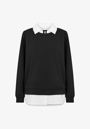 Black sweatshirt with a white collared shirt underneath, featuring long sleeves, a round neckline, and a hem that extends below the sweater.