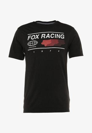 Czarny T-shirt z krótkim rękawem z nadrukiem "FOX RACING", ikoną globu z napisem "WORLDWIDE", czerwonymi sylwetkami lisa oraz rokiem "1974" na przodzie.