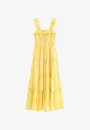 Gele mouwloze zomerjurk met gerimpelde bandjes, een geplooid lijfje en een gelaagde rok met kanten rand.