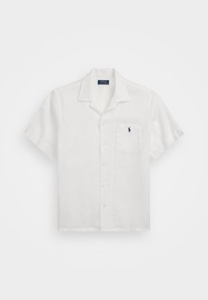 Chemise blanche à manches courtes avec col, poche poitrine comportant un petit logo Polo Ralph Lauren bleu marine.