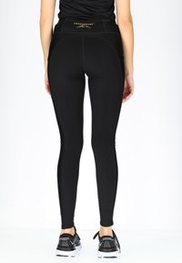 Swedemount PERFORMANCE TIGHTS W - Leggings - glossy black