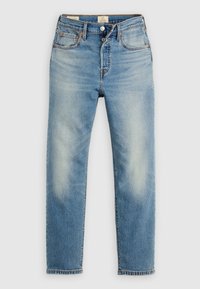 Ανοιχτό μπλε τζιν με ίσιο κόψιμο, ξεθωριασμένες λεπτομέρειες, αντίθετες ραφές, πέντε τσέπες και κούμπωμα με κουμπιά.