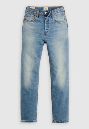 Svetlomodré riflové nohavice s rovnými nohavicami, vyblednutými detailmi, kontrastným šitím, piatimi vreckami a zapínaním na gombíky.