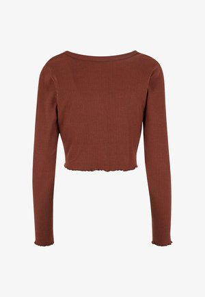 Langärmliges Cropped-Top aus geripptem, rostfarbenem Stoff. Verfügt über einen weiten Ausschnitt und einen gewellten Saum mit eng anliegenden Ärmeln.