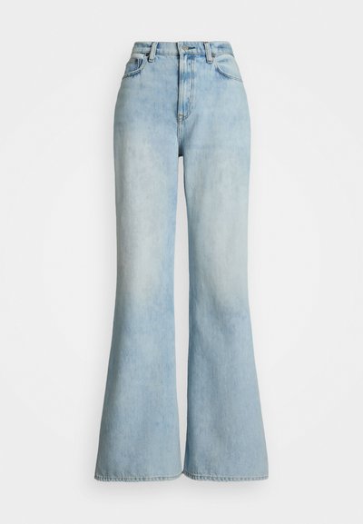 Light blue denim flared jeans with a high waist, featuring front pockets and a faded wash, designed for a loose fit from thigh to hem.