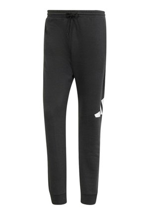 Pantalones deportivos negros hechos de tela suave, con cintura ajustable con cordón y un logotipo blanco en la pierna izquierda. Corte regular con piernas entalladas.