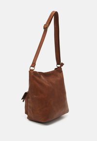 Brown leather shoulder bag with a soft texture, rectangular shape, adjustable strap, and a side pocket. Features brass hardware accents.