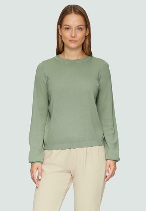 Pull en maille vert clair avec des manches longues et un col rond. Design simple avec des poignets et un ourlet côtelés. Assorti avec un pantalon couleur crème.