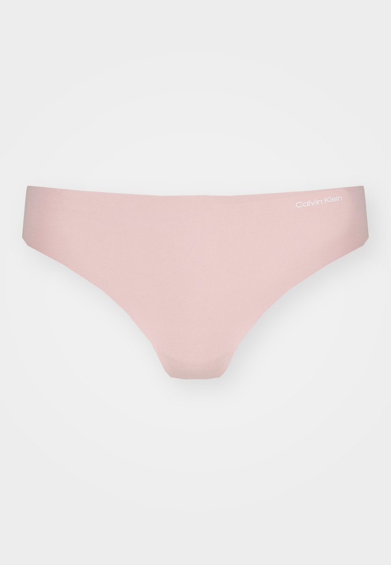 Helle rosafarbene Baumwoll-Tanga mit nahtlosem Design. Verfügt über eine weiche Textur und ein kleines weißes Calvin Klein-Logo am Bund.