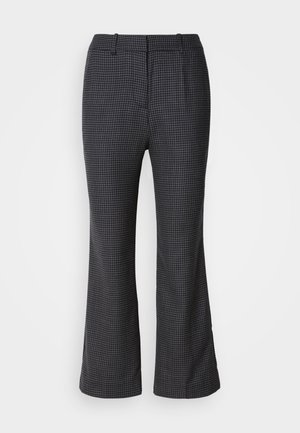 Tailored flared pants in a black and white houndstooth pattern, featuring a smooth texture and flat front with a classic waistband.