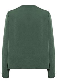 Blouse verte à manches longues en tissu texturé, avec une coupe droite et un col rond. Offre une coupe décontractée et un design simple sans embellissements.