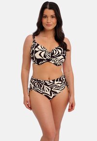 Bikini s černobílým vzorem, s twisted designem na vršku, nastavitelnými ramínky a vysokými kalhotkami se šněrováním po stranách.