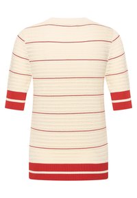Cream knit sweater featuring red horizontal stripes and bold red accents on the sleeves and hem. Short sleeves and ribbed neckline.