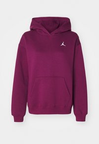 Sudadera morada hecha de una mezcla de algodón. Presenta un bolsillo tipo canguro, puños acanalados y un logo de Jordan en blanco en el pecho.