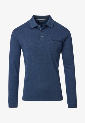 Tummansininen pitkähihainen polo paita, jossa on klassinen kaulus, nappilista ja rintatasku. Valmistettu teksturoidusta puuvillakankaasta.
