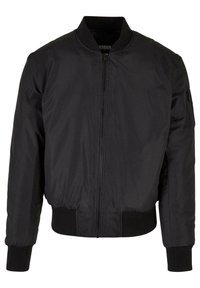 Chaqueta bomber negra con cierre de cremallera, puños y dobladillo acanalados, y un bolsillo lateral. Fabricada con un tejido suave y ligero.