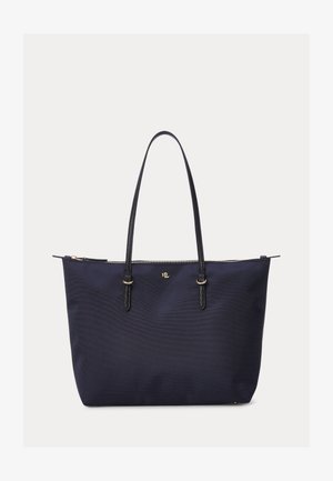 Sac cabas bleu marine avec longues poignées noires, fermeture éclair dorée en haut et petit logo RL doré au centre devant.