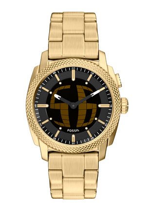 Montre-bracelet Fossil en métal doré avec lunette texturée, cadran noir, index dorés et bracelet à maillons.