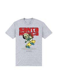 Šedé bavlněné tričko s grafikou skeletu ve skafandru, který na žlutém skateboardu jezdí, s nápisem "SANTA MONICA" v tučném červeném písmu.