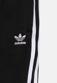 adidas Originals TREFOIL KIDS - Teplákové kalhoty - black