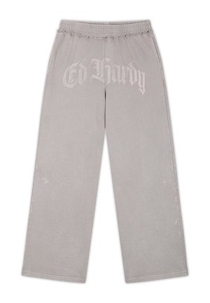 Vaaleanharmaat leveälahkeiset housut, joissa joustava vyötärö, edessä "Ed Hardy" -logo ja sivuilla hillityt kirjailut kukkakuosilla.