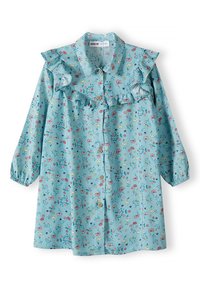 Camicia azzurra chiara con colletto arricciato e stampa floreale. Maniche lunghe con polsini elasticizzati. Tessuto morbido con piccoli bottoni decorativi.