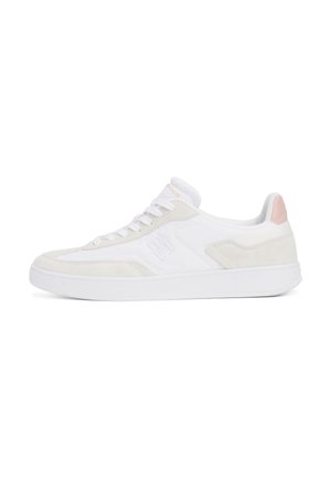White low-top sneaker with white laces, beige suede accents, embossed logo on side, and light pink heel tab on a white background.