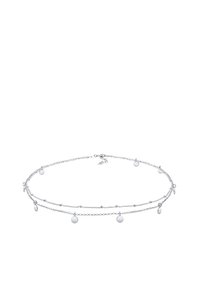 Silver layered necklace with small circular accents, featuring a delicate chain design and adjustable closure for length variation.