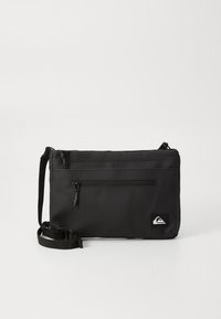 Black crossbody bag made of durable material, featuring one main zippered compartment and an exterior zippered pocket; adjustable strap.
