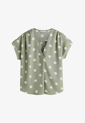 Világoszöld rövid ujjú blúz fehér pöttyökkel, puha V-nyakkivágással és összegyűrt anyag részletekkel a vállaknál és a nyakkivágásnál.