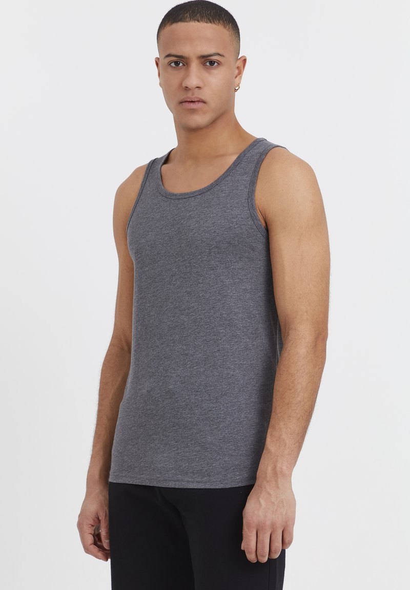 Gray cotton tank top with a round neckline and wide shoulder straps, featuring a soft texture and a fitted design.
