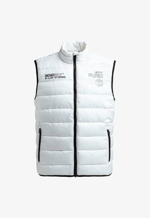 White puffer vest with a high collar, zip closure, side pockets, black trim, and printed text on the front. Smooth, insulated texture.