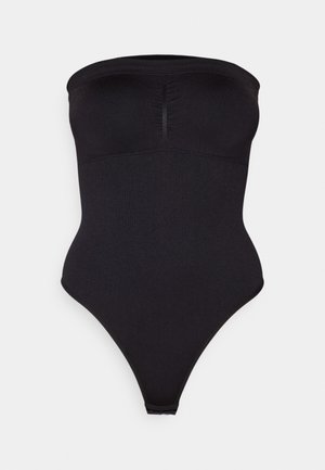 Black strapless bodysuit with a smooth texture, featuring a gathered front, high-cut leg openings, and a snug fit for shaping.